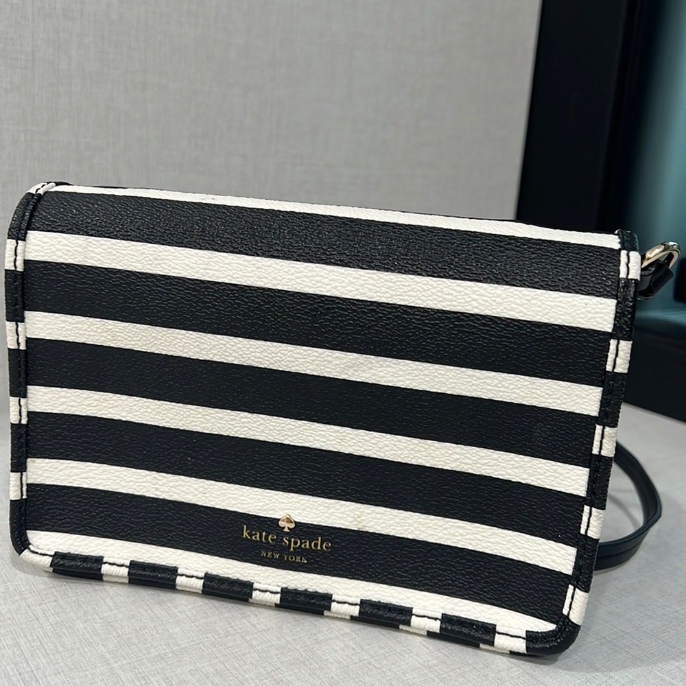 Kate Spade: white and black striped cross body bag